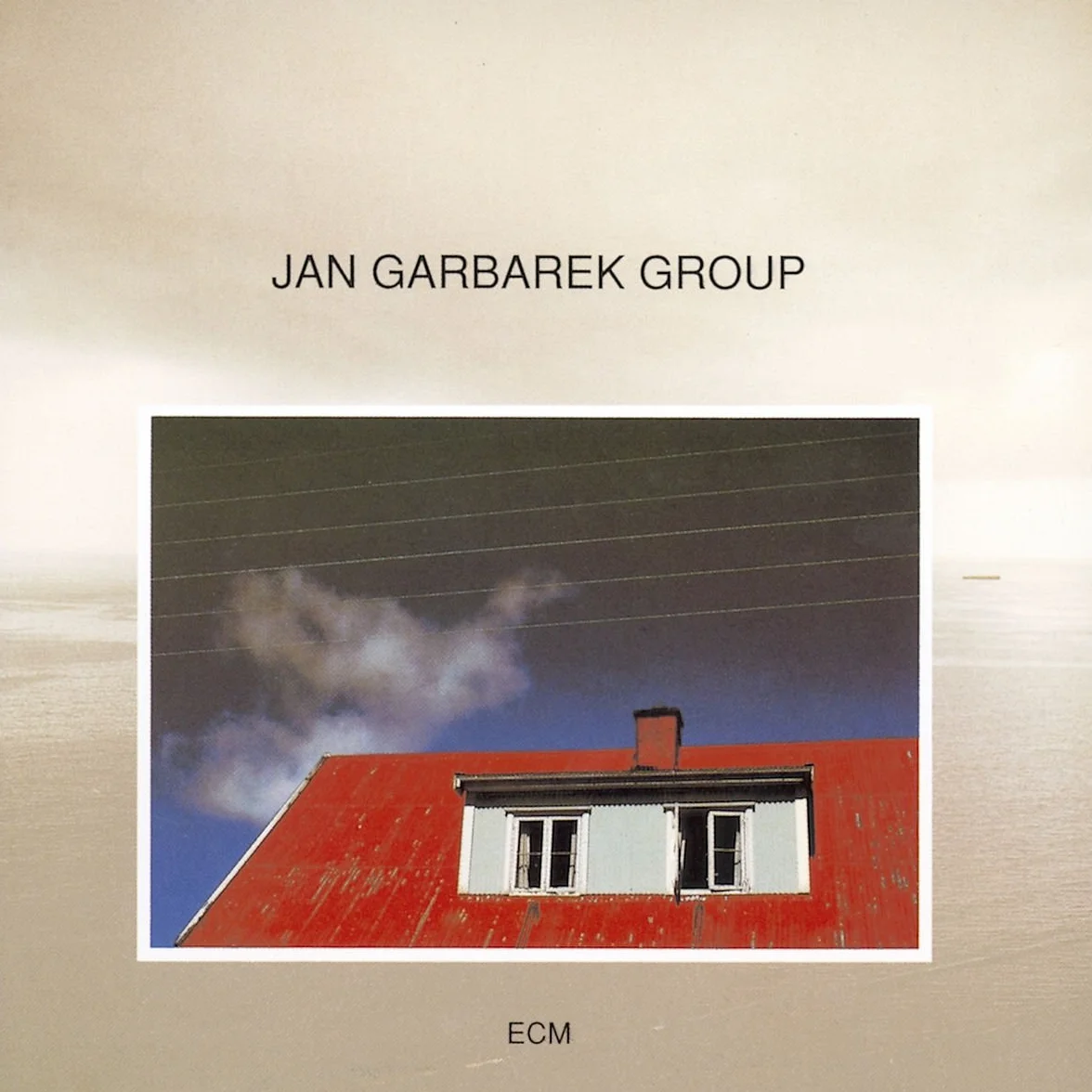 Photo With Blue Sky, White Cloud, Wires, Windows And A Red Roof